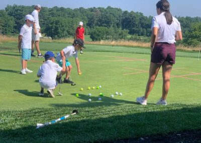 Children practicing on the golf putting green